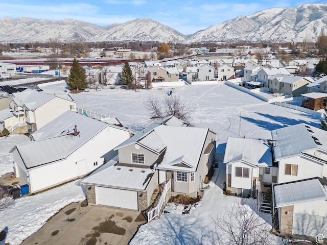 257 Rosewood Cir, Logan, UT 84321 - snowy aerial view featuring a residential view and a mountain view