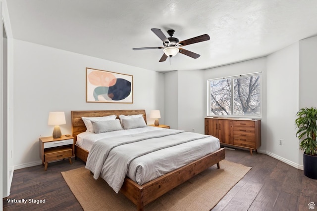 257 Rosewood Cir, Logan, UT 84321 - bedroom featuring a ceiling fan, dark wood finished floors, and baseboards