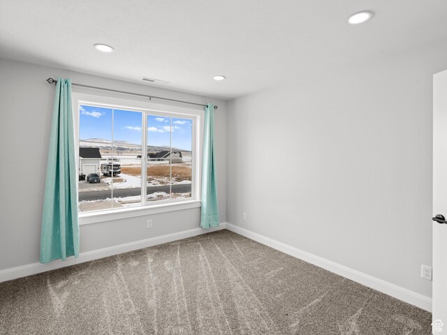 8345 W 11050 N, Tremonton, UT 84337 - unfurnished room with carpet flooring, visible vents, baseboards, and recessed lighting
