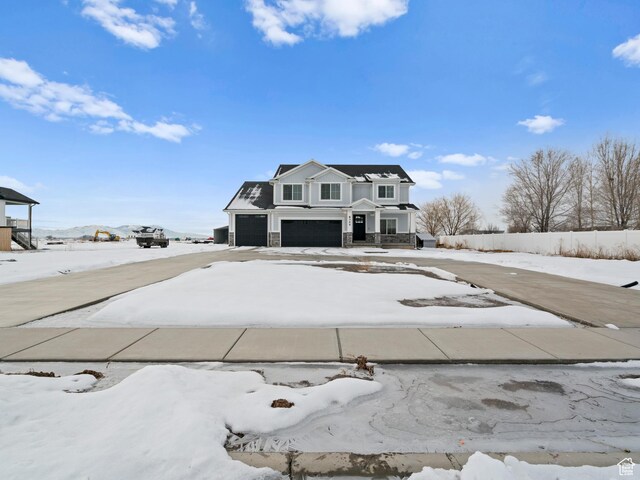 8345 W 11050 N, Tremonton, UT 84337 - view of front of property featuring stone siding and an attached garage
