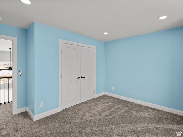8345 W 11050 N, Tremonton, UT 84337 - unfurnished bedroom featuring carpet flooring, baseboards, and recessed lighting