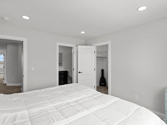 8345 W 11050 N, Tremonton, UT 84337 - carpeted bedroom with baseboards, a spacious closet, ensuite bath, and recessed lighting
