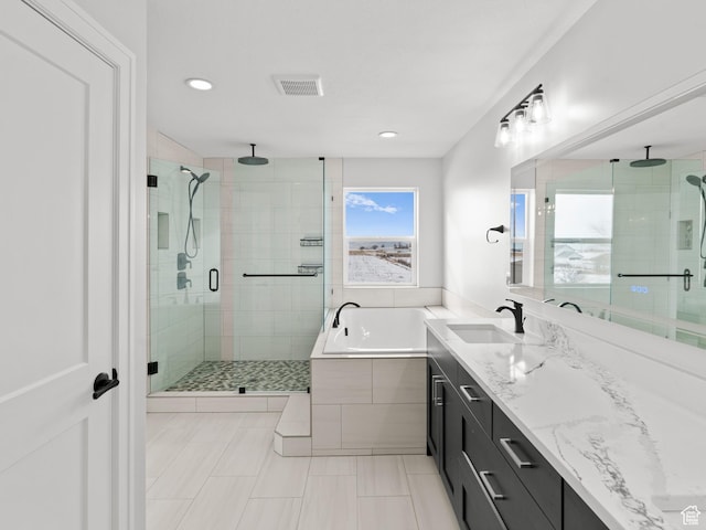 8345 W 11050 N, Tremonton, UT 84337 - full bath featuring a bath, visible vents, a shower stall, recessed lighting, and vanity