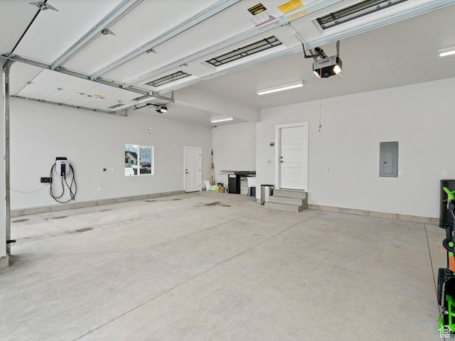 8345 W 11050 N, Tremonton, UT 84337 - garage with electric panel, baseboards, and a garage door opener