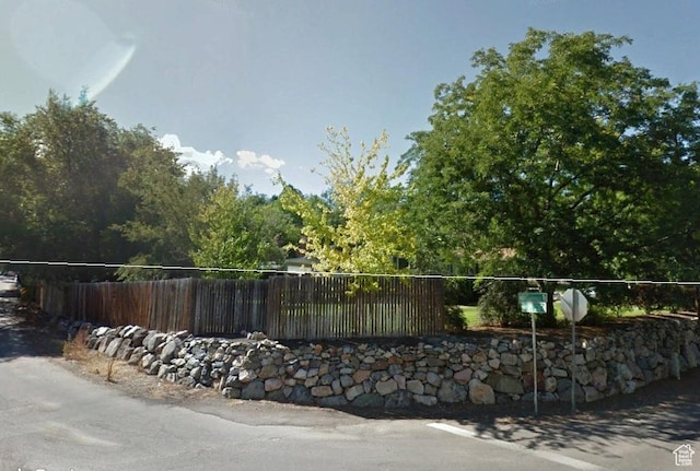 view of property's community with fence