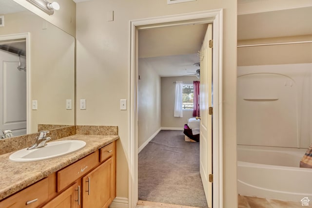 3842 S Clare Dr Unit D-1, West Valley City, UT 84119 - full bathroom featuring visible vents, vanity, baseboards, and ensuite bathroom