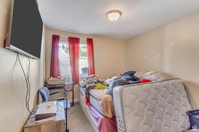 3842 S Clare Dr Unit D-1, West Valley City, UT 84119 - bedroom featuring a textured ceiling and light colored carpet