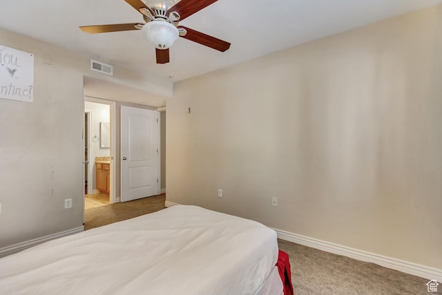 3842 S Clare Dr Unit D-1, West Valley City, UT 84119 - bedroom with light colored carpet, visible vents, ensuite bathroom, a ceiling fan, and baseboards