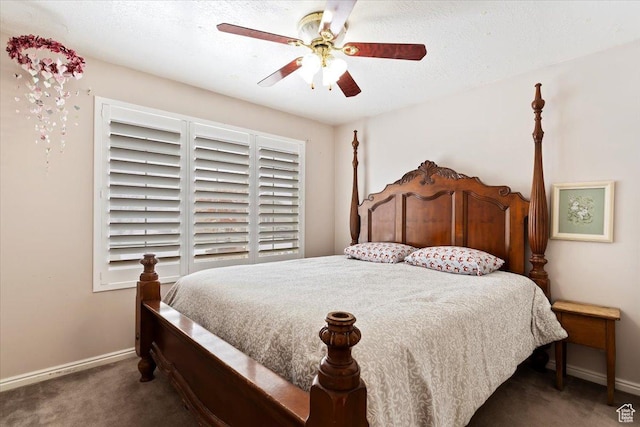 carpeted bedroom featuring baseboards and ceiling fan
