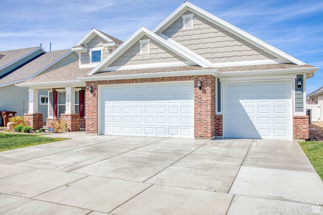 4386 W 3800 S, West Haven, UT 84401 - view of front of house featuring concrete driveway, brick siding, an attached garage, and a shingled roof