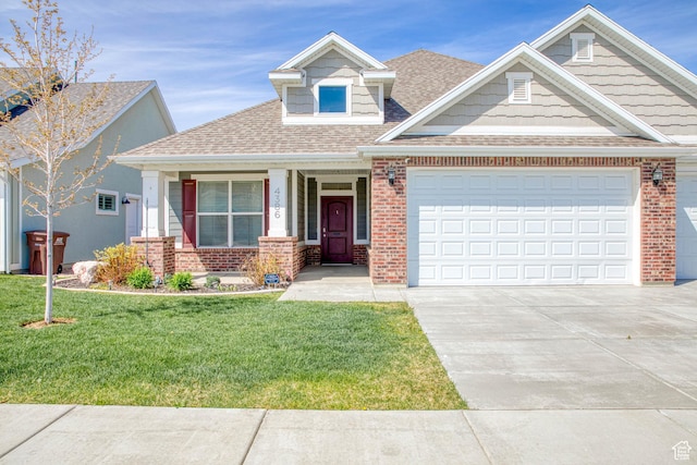 4386 W 3800 S, West Haven, UT 84401 - view of front of property featuring a front yard, concrete driveway, and brick siding
