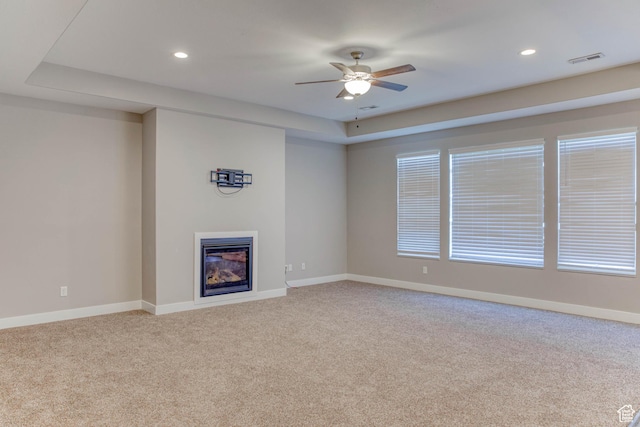 4386 W 3800 S, West Haven, UT 84401 - unfurnished living room featuring recessed lighting, visible vents, baseboards, carpet, and a glass covered fireplace
