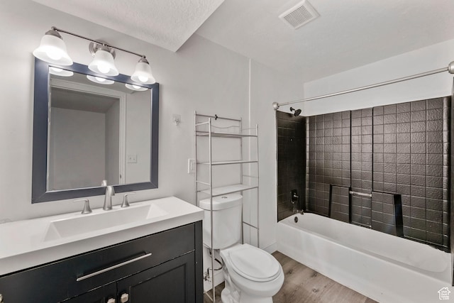 137 E Wentworth Ave, South Salt Lake, UT 84115 - bathroom with a textured ceiling, shower / tub combination, toilet, vanity, and visible vents