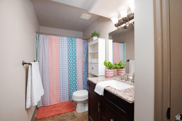 full bathroom with curtained shower, vanity, and toilet