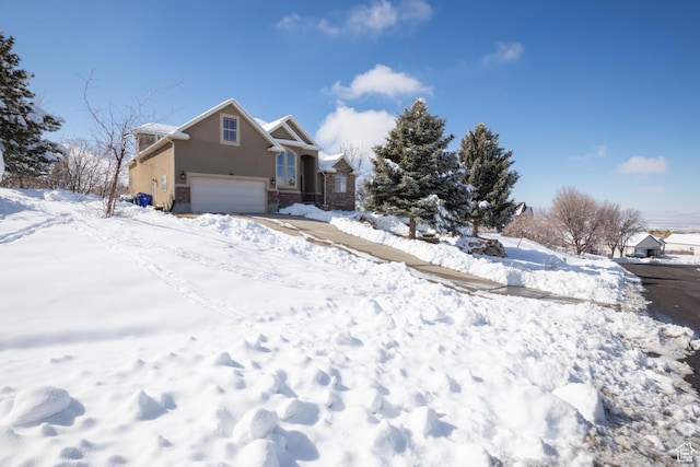 view of front of home featuring an attached garage and stucco siding