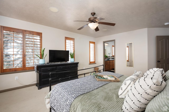 bedroom featuring carpet floors, ceiling fan, baseboards, and a textured ceiling