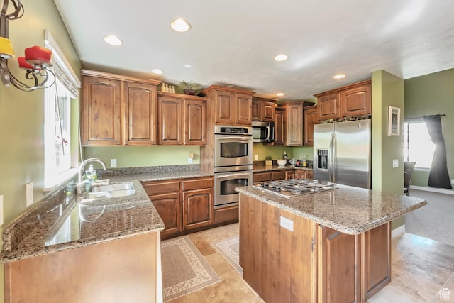 8783 N Franklin Dr, Eagle Mountain, UT 84005 - kitchen featuring brown cabinetry, a kitchen island, stainless steel appliances, a sink, and recessed lighting