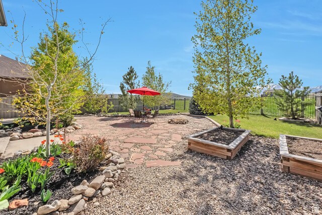 8783 N Franklin Dr, Eagle Mountain, UT 84005 - view of yard with a fenced backyard and a patio