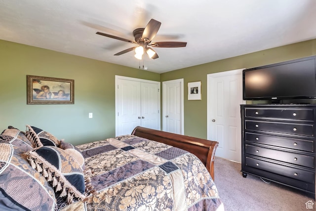 8783 N Franklin Dr, Eagle Mountain, UT 84005 - bedroom featuring ceiling fan, multiple closets, and light colored carpet