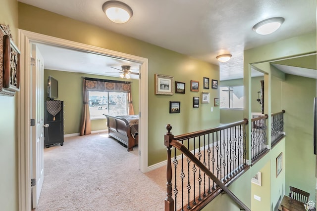8783 N Franklin Dr, Eagle Mountain, UT 84005 - corridor featuring light carpet, an upstairs landing, and baseboards