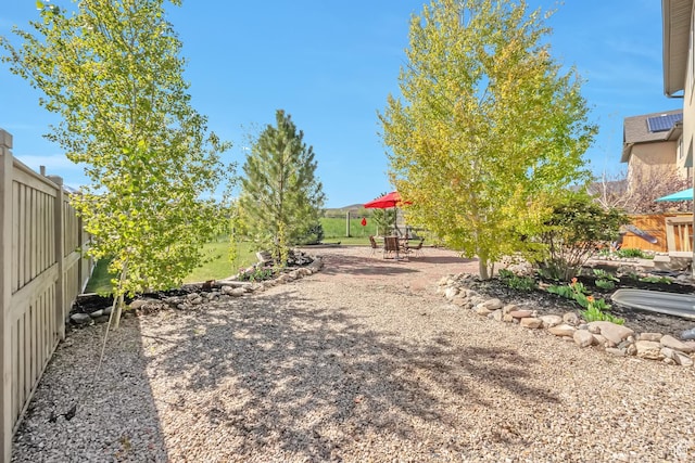 8783 N Franklin Dr, Eagle Mountain, UT 84005 - view of yard with a patio area and a fenced backyard