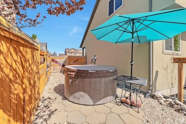 8783 N Franklin Dr, Eagle Mountain, UT 84005 - view of patio / terrace with a hot tub and a fenced backyard