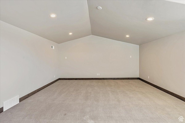 14408 N Buck Horn Trl N Unit 52C, Kamas, UT 84036 - unfurnished room with light carpet, baseboards, visible vents, and lofted ceiling