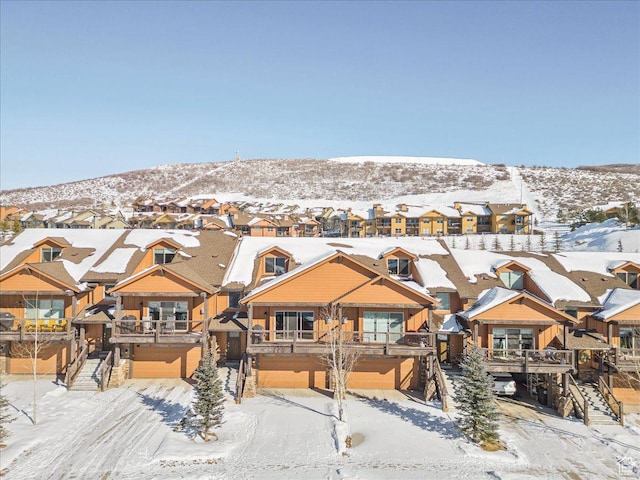 14408 N Buck Horn Trl N Unit 52C, Kamas, UT 84036 - view of front facade with a residential view, a mountain view, and an attached garage