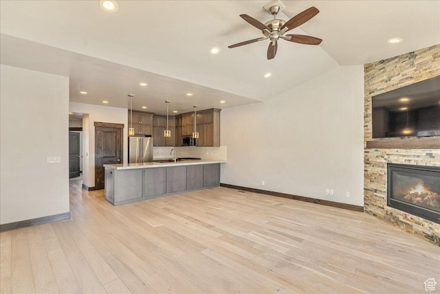 14408 N Buck Horn Trl N Unit 52C, Kamas, UT 84036 - kitchen featuring hanging light fixtures, stainless steel appliances, open floor plan, and light countertops
