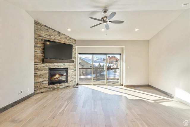 14408 N Buck Horn Trl N Unit 52C, Kamas, UT 84036 - unfurnished living room featuring light wood-style floors, baseboards, vaulted ceiling, and a stone fireplace