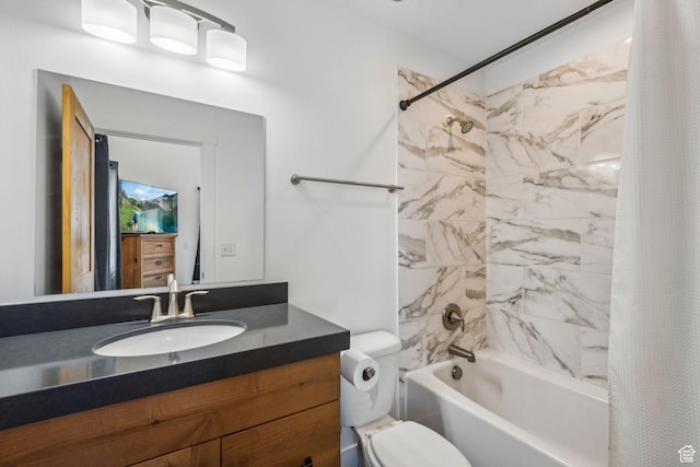 bathroom with shower / bath combo, vanity, and toilet