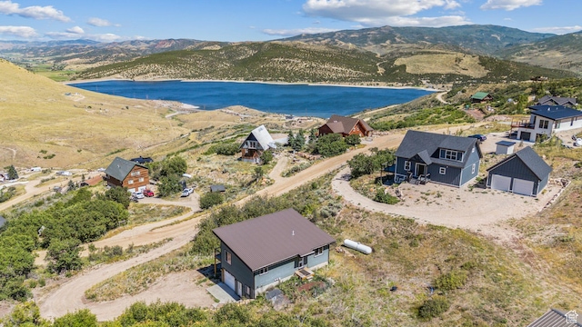 bird's eye view with a water and mountain view