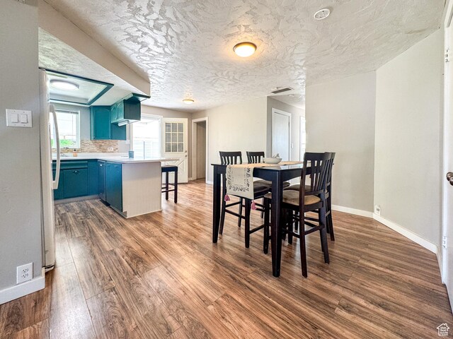 55 N 400 E, Heber City, UT 84032 - dining area with baseboards, dark wood finished floors, and a textured ceiling