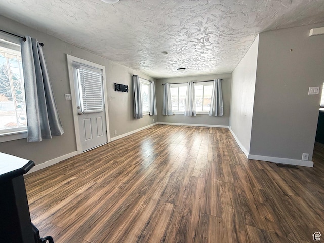 55 N 400 E, Heber City, UT 84032 - unfurnished living room with dark wood-style floors and baseboards