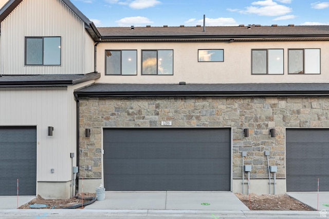 1786 N 180 E, Heber City, UT 84032 - view of front of home with a garage, stone siding, and concrete driveway