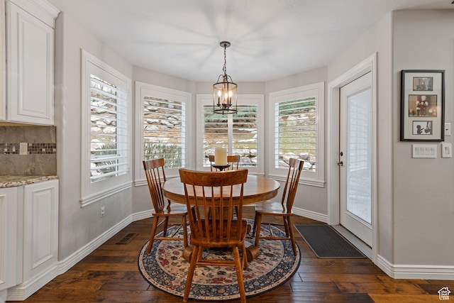 34 N Scenic Hills Cir E, North Salt Lake, UT 84054 - dining space featuring dark wood-style flooring, baseboards, and a chandelier