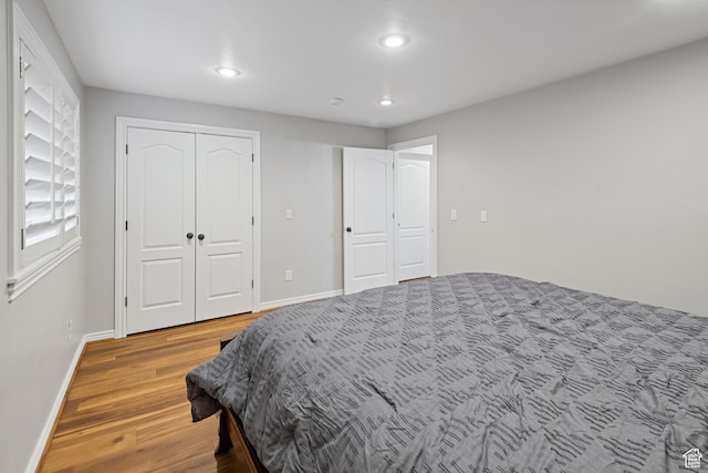 34 N Scenic Hills Cir E, North Salt Lake, UT 84054 - bedroom featuring light wood-type flooring, recessed lighting, and baseboards