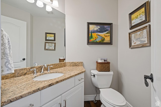 34 N Scenic Hills Cir E, North Salt Lake, UT 84054 - half bath with vanity, toilet, baseboards, and wood finished floors