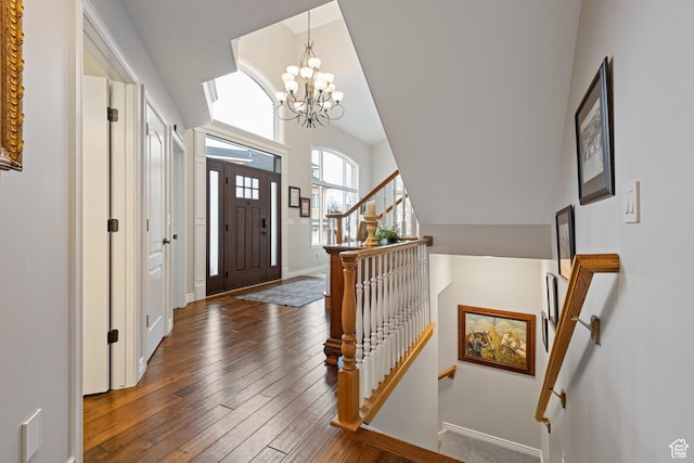 34 N Scenic Hills Cir E, North Salt Lake, UT 84054 - foyer entrance with hardwood / wood-style floors, a chandelier, baseboards, and lofted ceiling