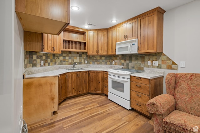 34 N Scenic Hills Cir E, North Salt Lake, UT 84054 - kitchen with white appliances, light wood-type flooring, decorative backsplash, a sink, and light countertops