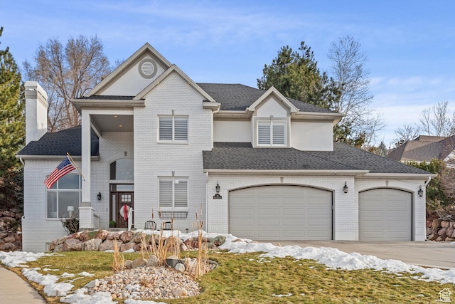 34 N Scenic Hills Cir E, North Salt Lake, UT 84054 - view of front of property with brick siding, a chimney, and a garage