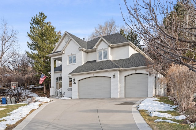 34 N Scenic Hills Cir E, North Salt Lake, UT 84054 - view of front facade featuring concrete driveway, a shingled roof, and an attached garage