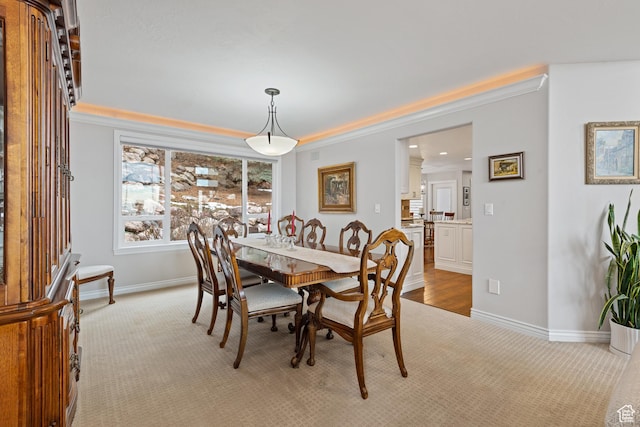 34 N Scenic Hills Cir E, North Salt Lake, UT 84054 - dining area with light carpet, baseboards, and ornamental molding