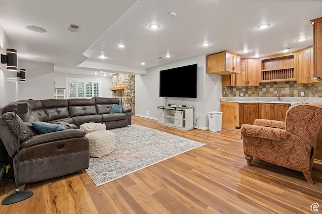 34 N Scenic Hills Cir E, North Salt Lake, UT 84054 - living room featuring light wood-style floors, baseboards, and recessed lighting