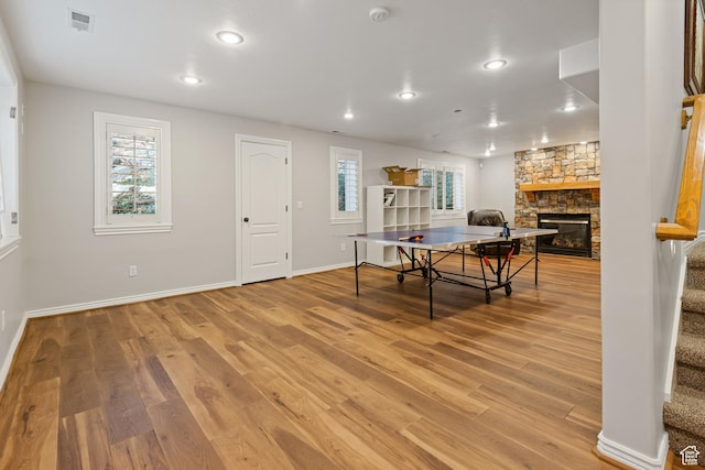 34 N Scenic Hills Cir E, North Salt Lake, UT 84054 - game room with a stone fireplace, healthy amount of natural light, light wood-style floors, baseboards, and recessed lighting