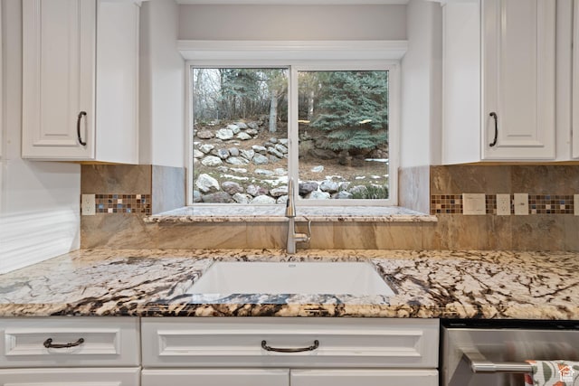 34 N Scenic Hills Cir E, North Salt Lake, UT 84054 - kitchen with a sink, light stone counters, white cabinetry, and tasteful backsplash