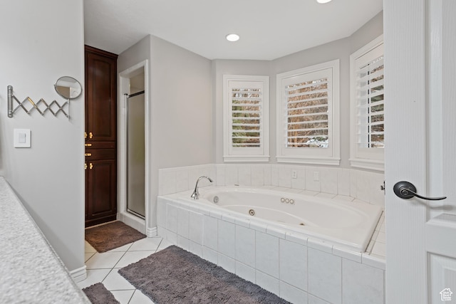 34 N Scenic Hills Cir E, North Salt Lake, UT 84054 - full bathroom featuring tile patterned flooring, a whirlpool tub, and a shower stall
