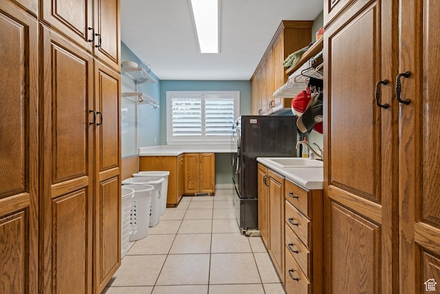 34 N Scenic Hills Cir E, North Salt Lake, UT 84054 - laundry room featuring cabinet space, light tile patterned floors, and independent washer and dryer