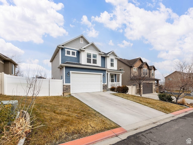 view of front of property with a garage, fence, a front lawn, and concrete driveway