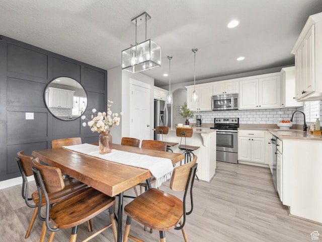 1463 S Lake View Terrace Rd, Saratoga Springs, UT 84045 - dining room with light wood-style floors and recessed lighting